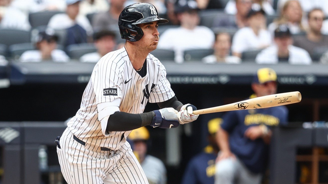 Mar 29, 2025; Bronx, New York, USA; New York Yankees left fielder Cody Bellinger (35) hits an RBI single in the sixth inning against the Milwaukee Brewers at Yankee Stadium. 