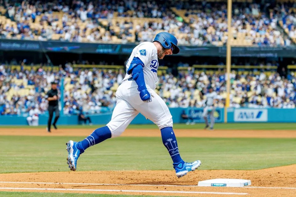 The Dodgers' Max Muncy reacts as he runs the bases after hitting a solo homer during Wednesday's game at Dodger Stadium.