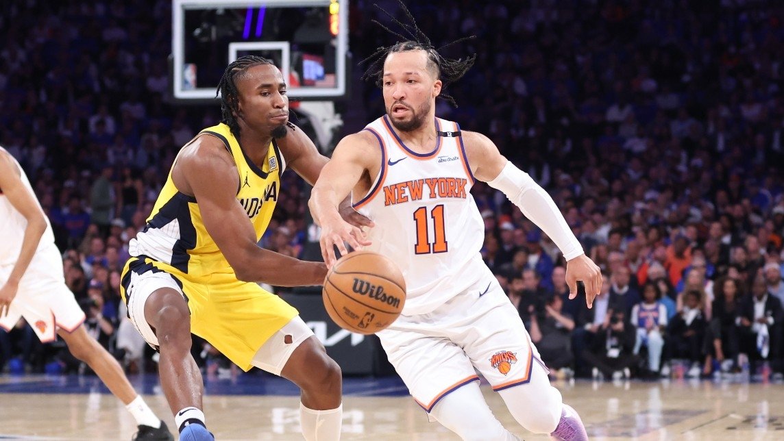 New York Knicks guard Jalen Brunson (11) controls the ball against Indiana Pacers forward Aaron Nesmith (23) in the third quarter during game one of the eastern conference finals for the 2025 NBA Playoffs at Madison Square Garden.