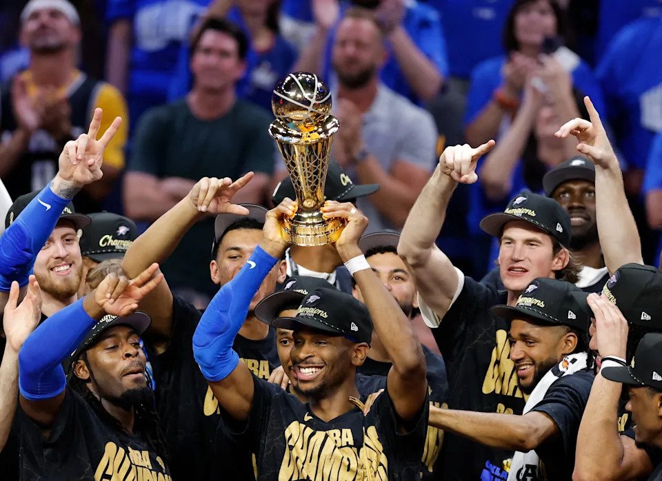 Jun 22, 2025; Oklahoma City, Oklahoma, USA; Oklahoma City Thunder guard Shai Gilgeous-Alexander (2) lifts the Larry O'Brien Championship Trophy as the Oklahoma City Thunder celebrate after winning game seven of the 2025 NBA Finals against the Indiana Pacers at Paycom Center. Mandatory Credit: Alonzo Adams-Imagn Images     TPX IMAGES OF THE DAY