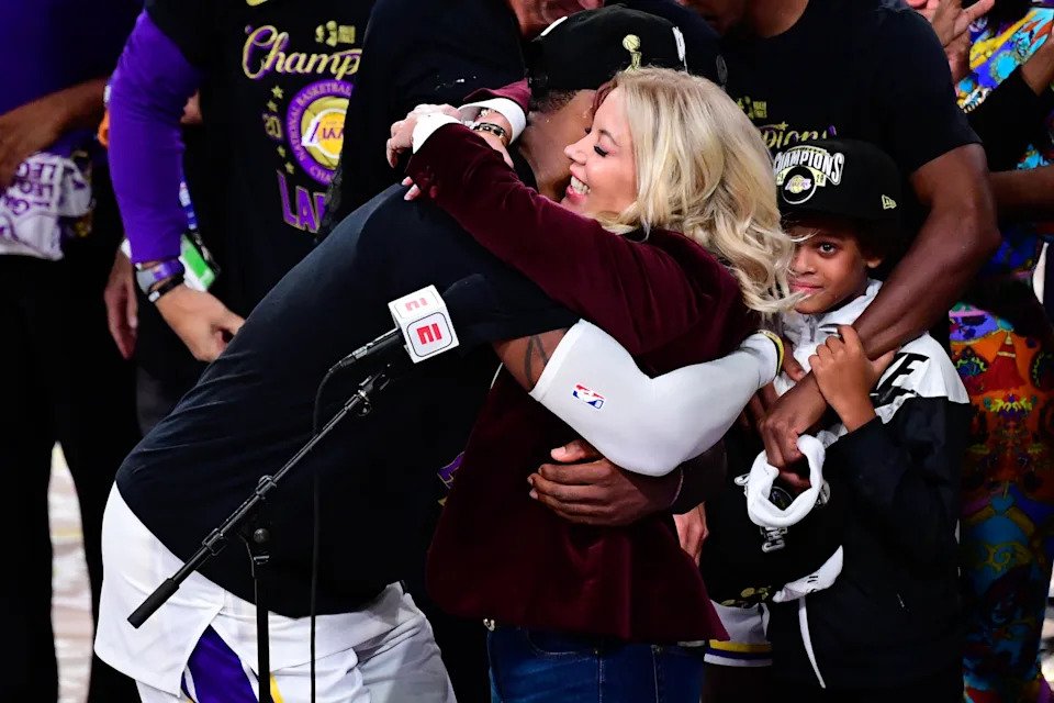 LAKE BUENA VISTA, FLORIDA - OCTOBER 11: LeBron James #23 and owner Jeanie Buss of the Los Angeles Lakers hug after winning the 2020 NBA Championship Final over the Miami Heat in Game Six of the 2020 NBA Finals at AdventHealth Arena at the ESPN Wide World Of Sports Complex on October 11, 2020 in Lake Buena Vista, Florida. NOTE TO USER: User expressly acknowledges and agrees that, by downloading and or using this photograph, User is consenting to the terms and conditions of the Getty Images License Agreement. (Photo by Douglas P. DeFelice/Getty Images)