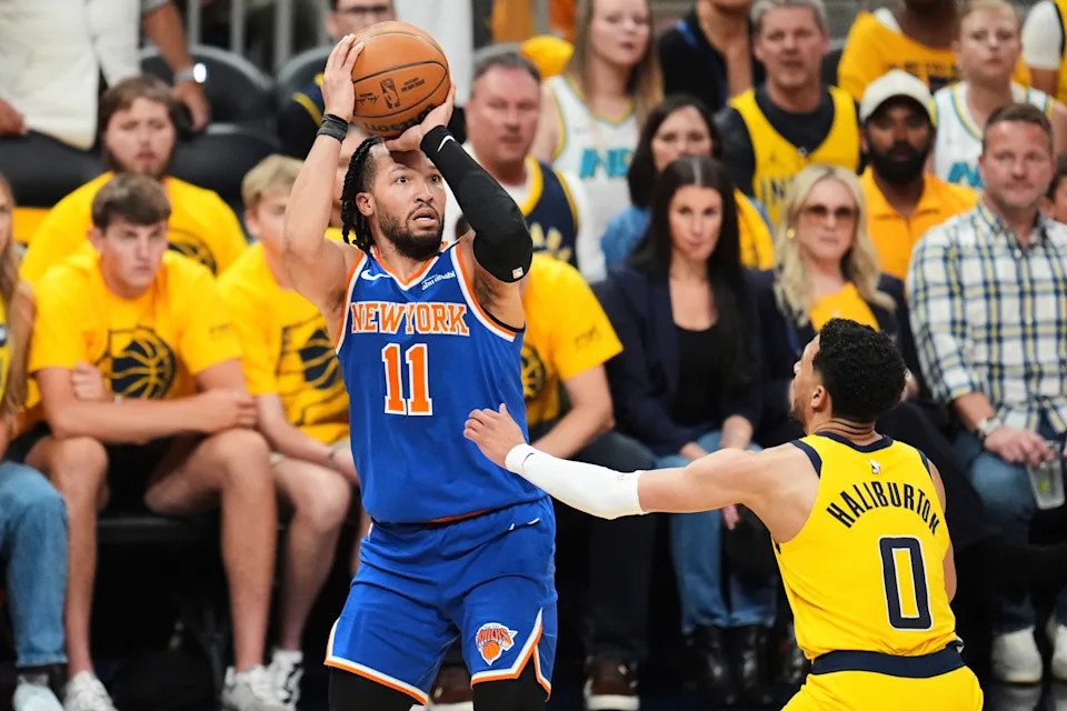New York Knicks guard Jalen Brunson (11) shoots against Indiana Pacers guard Tyrese Haliburton (0) during the first half of Game 6 of the Eastern Conference finals of the NBA basketball playoffs in Indianapolis, Saturday, May 31, 2025. (AP Photo/Michael Conroy)