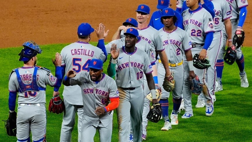Participants of the New york city Mets commemorate beating the Colorado Mountain ranges at Coors Area.