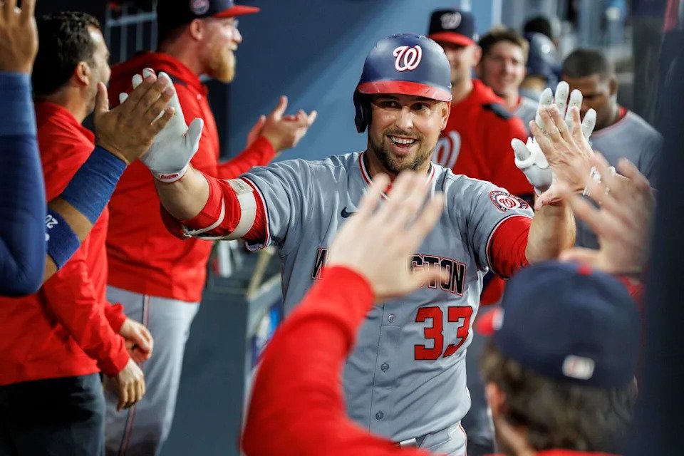 Washington's Nathaniel Lowe celebrates in the dugout after hitting his second home run of the game.