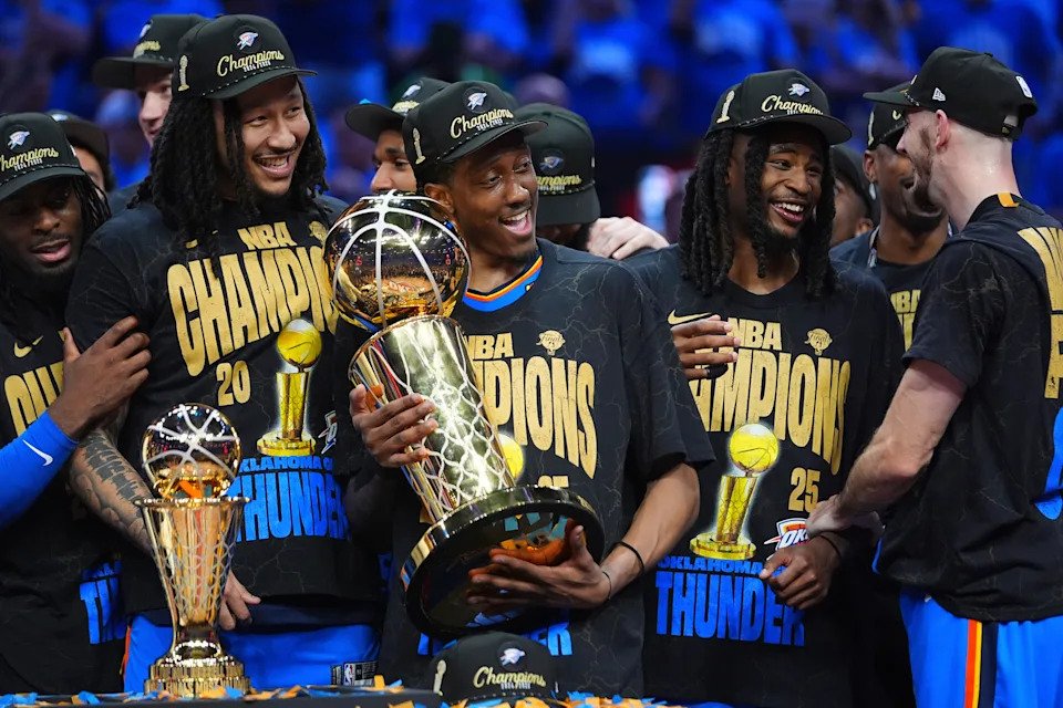 Oklahoma City Thunder forward Jalen Williams (8) holds the Larry O'Brien Championship Trophy as he celebrates with his team after they won the NBA basketball championship with a Game 7 victory against the Indiana Pacers Sunday, June 22, 2025, in Oklahoma City. (AP Photo/Julio Cortez)