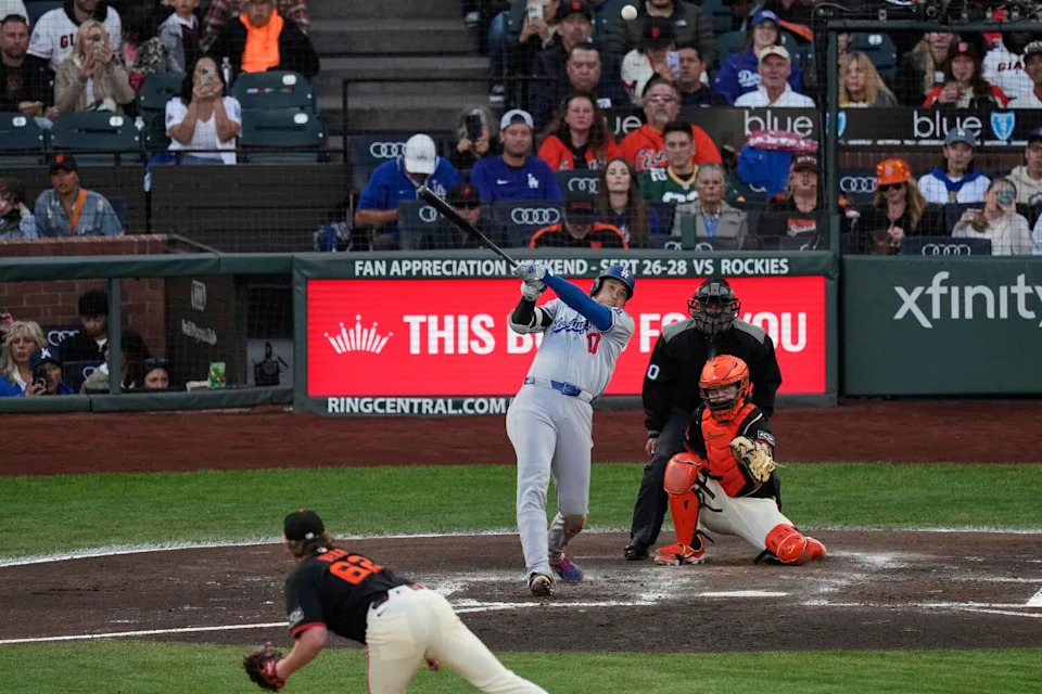 Shohei Ohtani hits a solo home run in the third inning Saturday against the Giants.