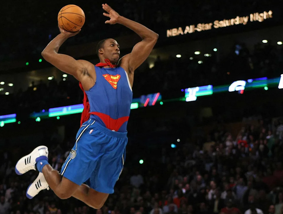 Dwight Howard of the Orlando Magic wearing a Superman cape in the Sprite Slam-Dunk Contest at the New Orleans Arena during the 2008 NBA All-Star Weekend February 16, 2008 in New Orleans, Louisiana.   AFP PHOTO    TIMOTHY A. CLARY (Photo by Timothy A. CLARY / AFP) (Photo by TIMOTHY A. CLARY/AFP via Getty Images)