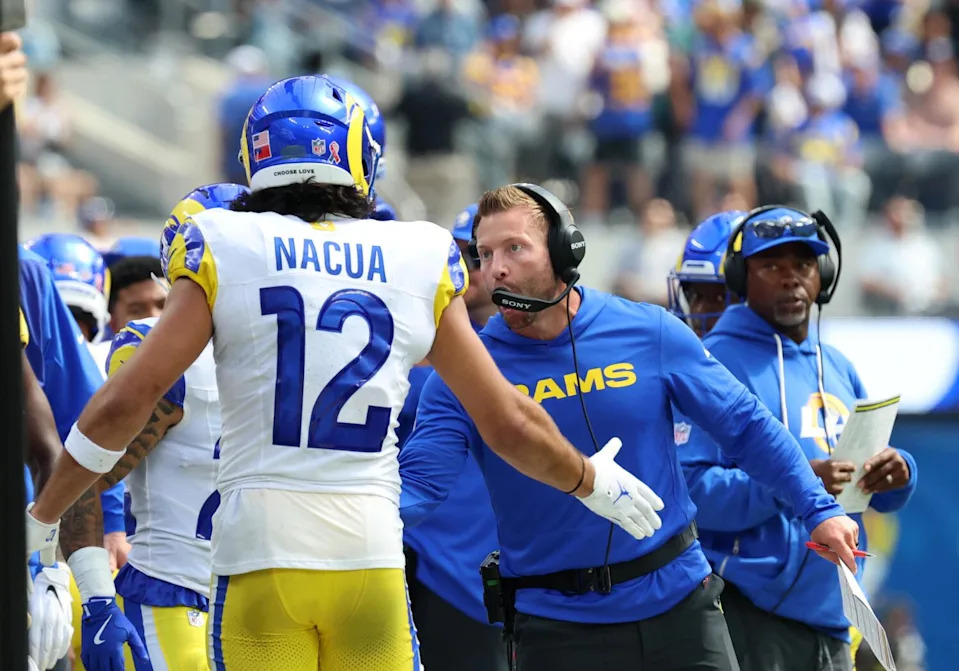 Rams coach Sean McVay shares a hand slap with wide receiver Puka Nacua during the Rams' season-opening win.