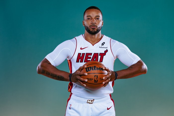 Normall Powell holds the basketball with both hands during a photo shoot with the Miami Heat
