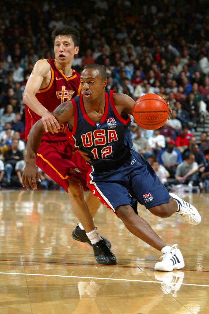 Jay Williams of the USA Basketball men's championship team drives to the basket against the China men's world championship team.